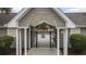 Pool entrance with gate, columns, and peaked roof showing posted rules at 1442 Chanson Ct., Little River, SC 29566