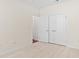 Bedroom with light wood floors, neutral walls, and a closet with double doors at 1537 Beaumont Way, Myrtle Beach, SC 29577