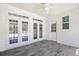 Covered patio with tiled floors and multiple entry points at 1537 Beaumont Way, Myrtle Beach, SC 29577