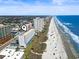 Oceanfront condo building featuring beach access, stunning coastline views, and nearby amenities at 1709 S Ocean Blvd. # 411, North Myrtle Beach, SC 29582