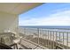 Spacious balcony showcasing views of the beach, ocean, and clear blue sky at 1709 S Ocean Blvd. # 411, North Myrtle Beach, SC 29582