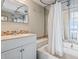 Bathroom featuring a shower-tub combination, vanity with a sink, and mosaic tile accents at 1709 S Ocean Blvd. # 411, North Myrtle Beach, SC 29582