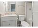 Compact bathroom featuring a vanity with tiled backsplash and a glass-enclosed shower stall at 1709 S Ocean Blvd. # 411, North Myrtle Beach, SC 29582