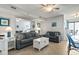 Comfortable living room featuring neutral-toned sofas, a white chest, and beach-themed decor at 1709 S Ocean Blvd. # 411, North Myrtle Beach, SC 29582