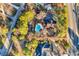 An aerial view shows a home with a pool, bordered by lush landscaping at 1800 Glenns Bay Rd., Surfside Beach, SC 29575