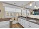 Bathroom with a large bathtub, granite countertop, and bright natural light at 1800 Glenns Bay Rd., Surfside Beach, SC 29575