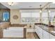 Bright bathroom with jacuzzi tub, separate glass shower, and granite topped vanity at 1800 Glenns Bay Rd., Surfside Beach, SC 29575