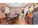 Dining room boasts wood floors, complemented by neutral walls and plenty of natural light at 1800 Glenns Bay Rd., Surfside Beach, SC 29575