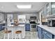 Modern kitchen featuring stainless steel appliances, ample counter space, and an island at 1800 Glenns Bay Rd., Surfside Beach, SC 29575