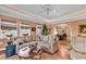 Spacious living room featuring tile floors, recessed lights, and natural light with an archway to the dining area at 1800 Glenns Bay Rd., Surfside Beach, SC 29575