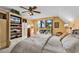 Bright main bedroom features built-in storage, large window, and ceiling fan at 1800 Glenns Bay Rd., Surfside Beach, SC 29575