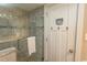 Modern bathroom featuring a glass-enclosed shower with stylish tile and fixtures at 2001 S Ocean Blvd. # 405, Myrtle Beach, SC 29577