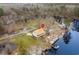 Aerial view of a raised river house featuring a metal roof and dock at 202 Cypress Knee Ct., Conway, SC 29526