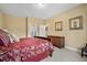 Inviting bedroom with comfortable bed, decor, and en-suite bathroom at 202 Cypress Knee Ct., Conway, SC 29526