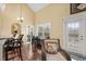 Bright dining area with bar seating and a view to outdoor greenery at 202 Cypress Knee Ct., Conway, SC 29526