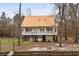 Raised beach home with metal roof featuring a spacious porch, perfect for relaxing at 202 Cypress Knee Ct., Conway, SC 29526