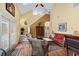 Bright living room with vaulted ceiling, cozy seating, and staircase to the upper level at 202 Cypress Knee Ct., Conway, SC 29526