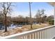 Scenic water view from a balcony, overlooking a river and wooded area with a private dock at 202 Cypress Knee Ct., Conway, SC 29526