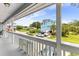 View from the balcony overlooking a street with houses, palm trees and parked cars at 202 Old Harbour Ct., Little River, SC 29566