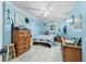 Charming bedroom with coastal decor, light blue walls, and plenty of natural light at 202 Old Harbour Ct., Little River, SC 29566