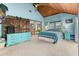 Bedroom featuring wood ceiling, bright blue walls, and barn door to another room at 202 Old Harbour Ct., Little River, SC 29566