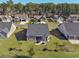 Aerial view of the home showcasing its well-maintained lawn and the community at 2051 Lindrick Ct., Calabash, NC 28467