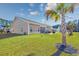 Expansive backyard featuring a covered patio and a lush green lawn at 2051 Lindrick Ct., Calabash, NC 28467