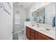 Bathroom featuring double vanity sinks, wood cabinets and nautical decor at 2051 Lindrick Ct., Calabash, NC 28467