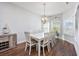 Dining room with hardwood floors and a large table with seating for eight at 2051 Lindrick Ct., Calabash, NC 28467