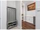 Inviting hallway with coat rack and view to a naturally lit hall with lovely hardwood floors at 2051 Lindrick Ct., Calabash, NC 28467