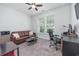 Home office with a comfortable sofa and modern desk at 2051 Lindrick Ct., Calabash, NC 28467