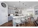 Modern kitchen with white countertops, gray cabinets, stainless steel appliances, and a breakfast bar at 2051 Lindrick Ct., Calabash, NC 28467