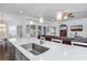 Bright kitchen featuring an island with a stainless steel sink and hanging pendant lights at 2051 Lindrick Ct., Calabash, NC 28467