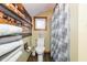 Bathroom showcasing wood features, towels, and a toilet with a standard shower at 2270 Vereen Circle, Little River, SC 29566