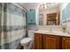 Traditional bathroom with a single sink vanity and a combination shower and tub with a fabric curtain at 2270 Vereen Circle, Little River, SC 29566