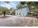 Charming home featuring light-blue siding, a large driveway, and yellow window shutters at 2270 Vereen Circle, Little River, SC 29566