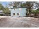 Charming home featuring light-blue siding, a large driveway, and yellow window shutters at 2270 Vereen Circle, Little River, SC 29566