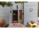 Welcoming front entrance with light blue siding and a decorative welcome mat at 2270 Vereen Circle, Little River, SC 29566