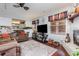 Inviting living room features a fireplace, hardwood floors, neutral walls, and a view to the kitchen at 2270 Vereen Circle, Little River, SC 29566