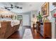 Spacious living room featuring hardwood floors, a ceiling fan, and lots of natural light at 2270 Vereen Circle, Little River, SC 29566