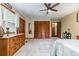 Spacious main bedroom showcasing wood furnishings, soft carpet, and a ceiling fan at 2270 Vereen Circle, Little River, SC 29566