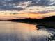 Scenic waterfront view at sunset, with a pier extending into the calm river at 2270 Vereen Circle, Little River, SC 29566