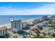 Aerial view of the tall modern condo complex and its surroundings on the beach at 2301 S Ocean Blvd. # 1401, North Myrtle Beach, SC 29582