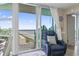 Relaxing balcony with a comfortable recliner and sliding glass doors offering stunning ocean views at 2301 S Ocean Blvd. # 1401, North Myrtle Beach, SC 29582