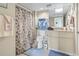 Cozy bathroom showcases a shower with nautical themed shower curtain and coordinating towels at 2301 S Ocean Blvd. # 1401, North Myrtle Beach, SC 29582