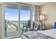 Inviting bedroom with balcony access and ocean views at 2301 S Ocean Blvd. # 1401, North Myrtle Beach, SC 29582