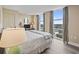 Bright bedroom with large windows and views of the surrounding area and hardwood floors at 2301 S Ocean Blvd. # 1401, North Myrtle Beach, SC 29582