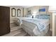 Comfortable bedroom featuring two queen beds with seaside themed decor and hardwood floors at 2301 S Ocean Blvd. # 1401, North Myrtle Beach, SC 29582