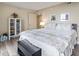 Relaxing bedroom with white bookshelf, seating bench and hardwood floors at 2301 S Ocean Blvd. # 1401, North Myrtle Beach, SC 29582