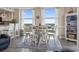 Bright dining area with modern decorations, table set for six, and large windows with scenic views at 2301 S Ocean Blvd. # 1401, North Myrtle Beach, SC 29582